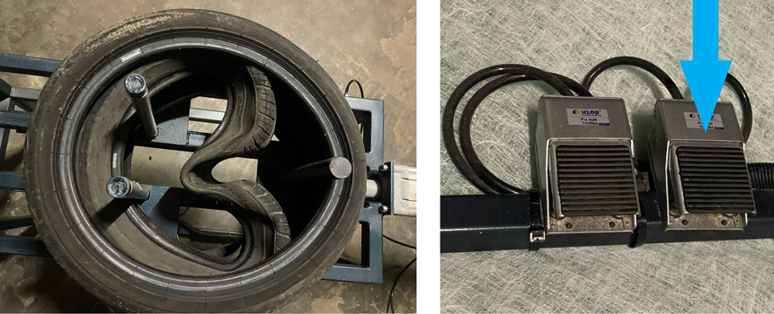 De-clamping the inner tyre – Once the larger tyre has been correctly positioned you can de-clamp the inner tyre. To do this, press the right foot switch, this will cause the pusher to retract. On releasing the switch, the pusher will stop. 