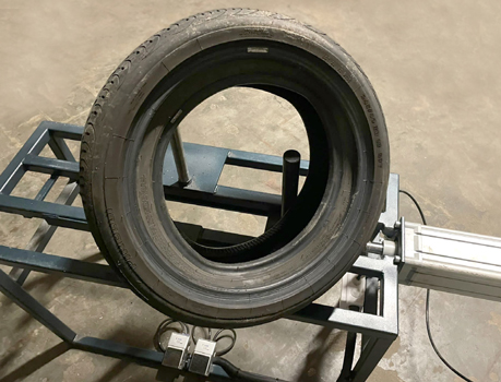 Packing the tyre –  Once the machine has stopped, you can lift the tyres off the machine. If you want to add a third tyre to the pack, repeat the process. The package of two tyres should now be treated as a single, smaller tyre, with a bigger tyre placed over it. 